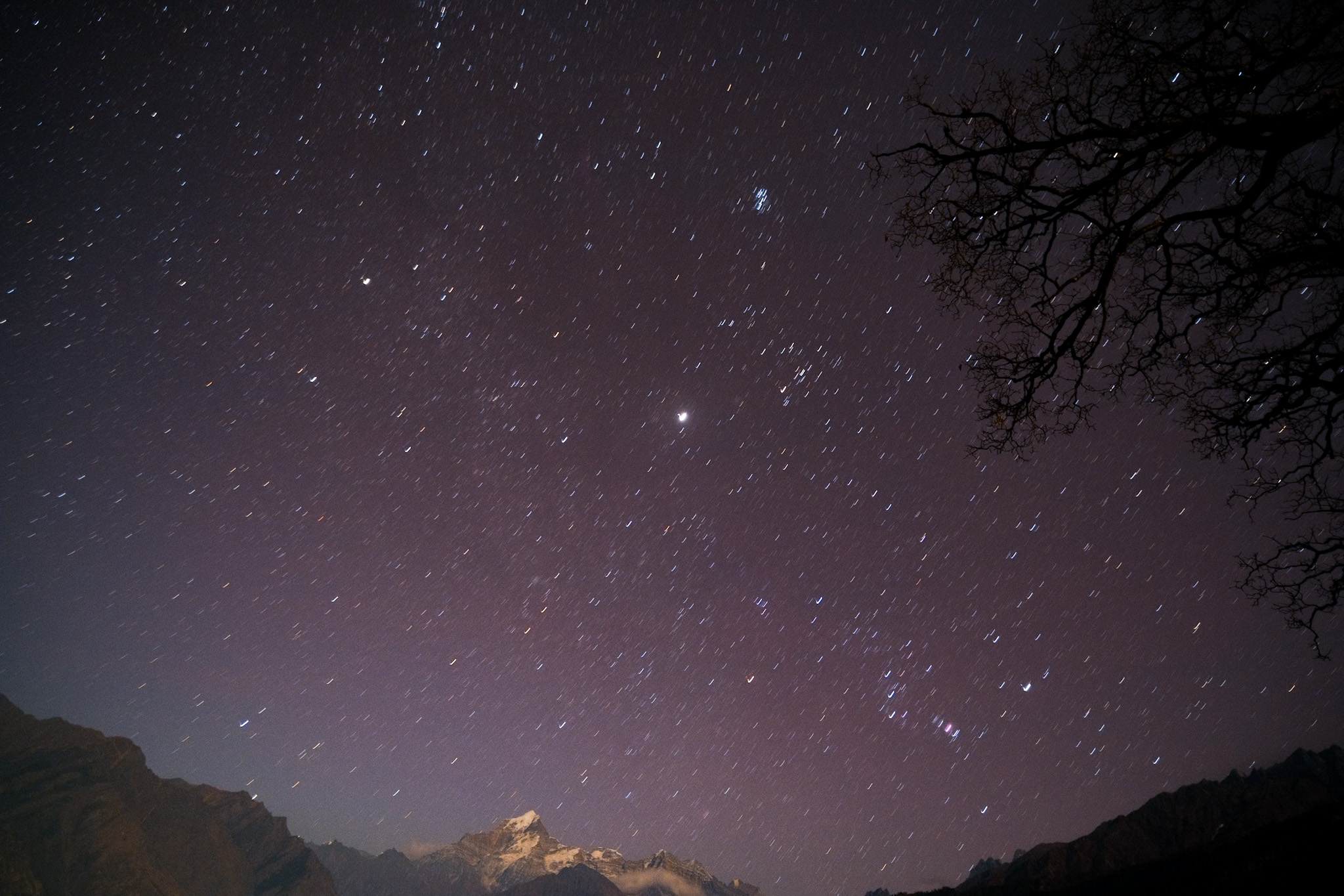 night sky over mountain peaks